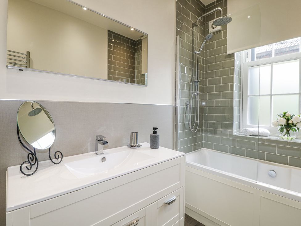 A bathroom with a wash basin, shower and bathtub at Deeley House in Darley Dale