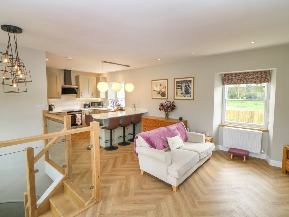 A living room and kitchen combined space at Ashlea Oxton near Lauder