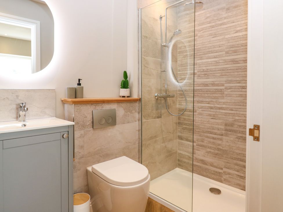 A bathroom with sink and shower at Ashlea in Oxton near Lauder