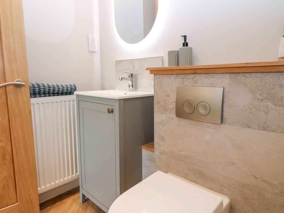 A bathroom with a sink and toilet at Ashlea in Oxton near Lauder