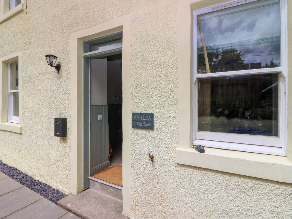 An entrance viewed from outside with a nameplate at Ashlea in Oxton near Lauder