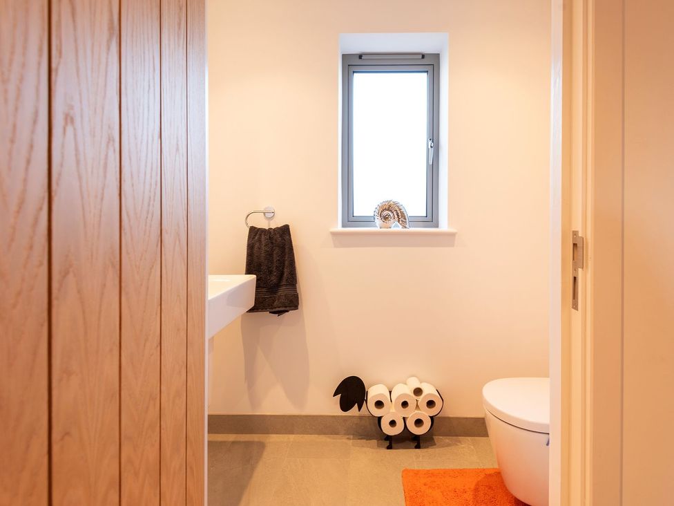 A bathroom with a sink and toilet at Pentire St Minver
