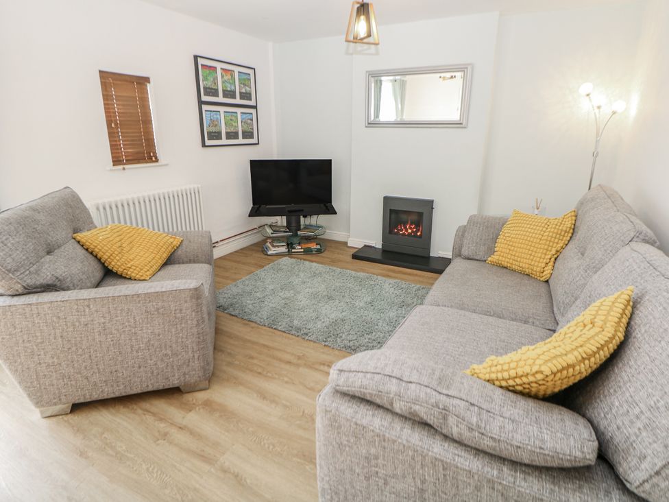A living room with a sofa and television at 6 Fidlers Close Bamford
