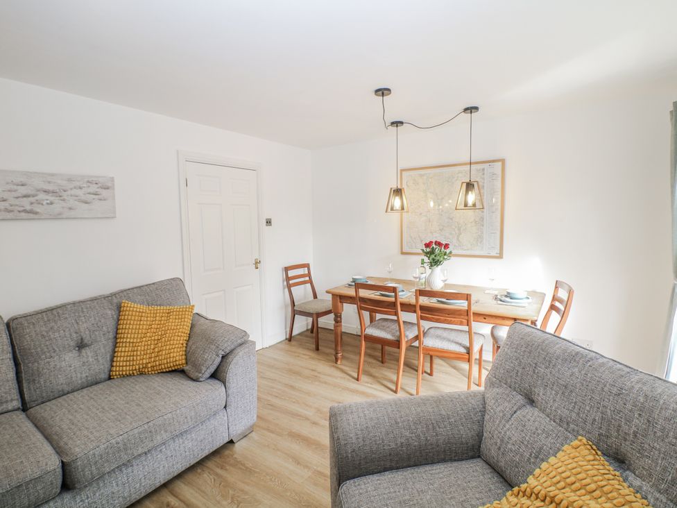 A dining room with a table and chairs at 6 Fidlers Close Bamford