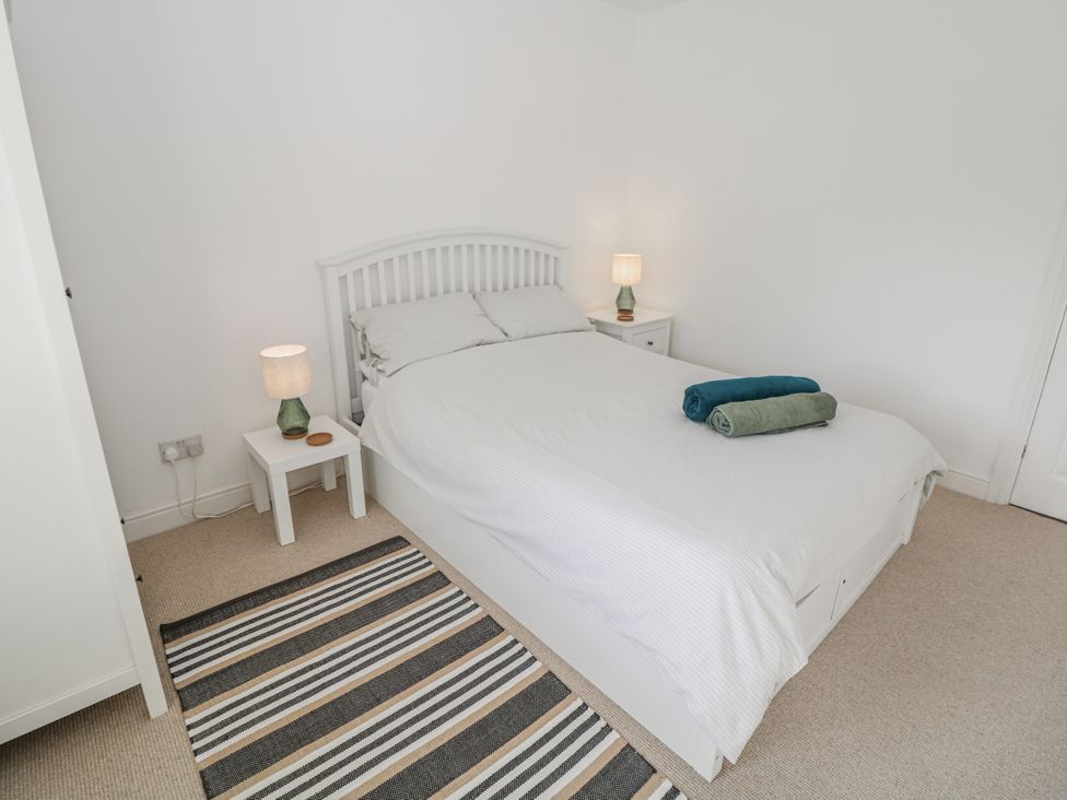 A bedroom with a bed and nightstand at 6 Fidlers Close in Bamford