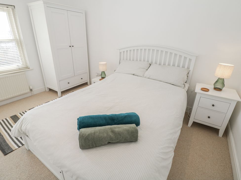 A bedroom with a bed and wardrobe at 6 Fidlers Close in Bamford
