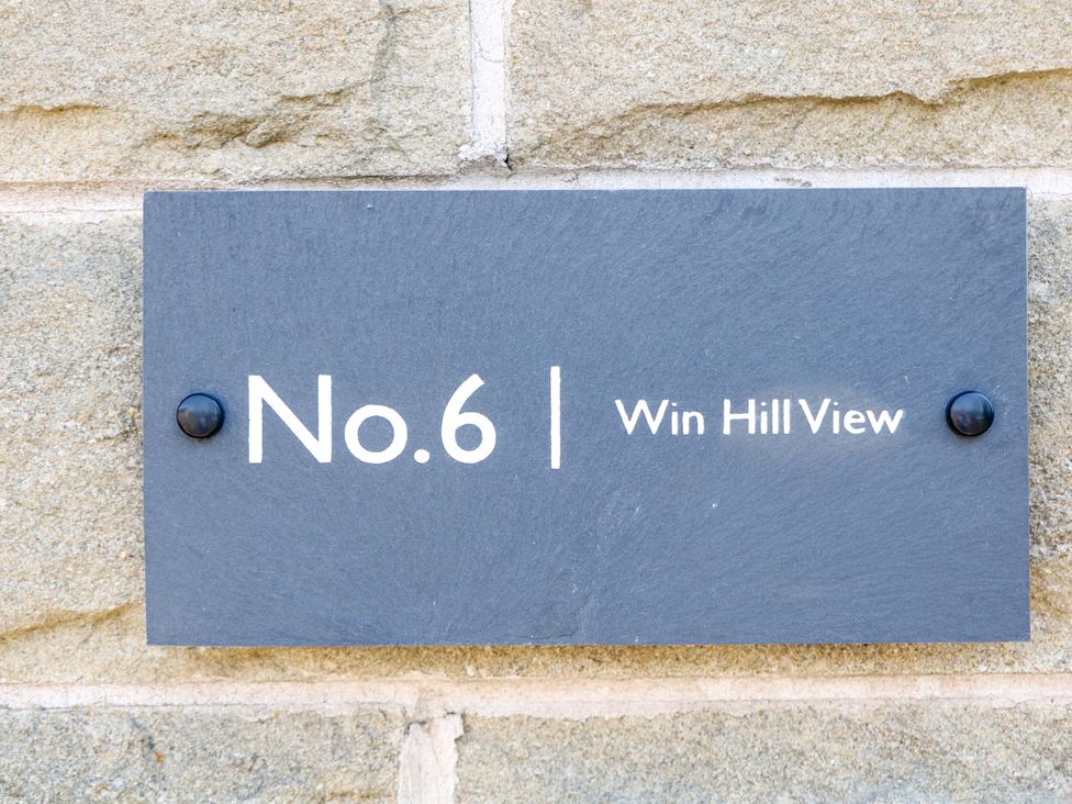 A plaque with No. 6 and Win Hill View at Win Hill View in Bamford