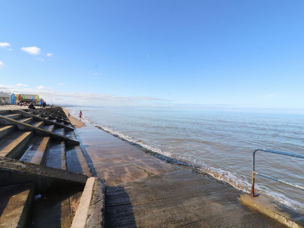 A beach with steps leading to the sea at Lido Silver Plus 111 in Prestatyn