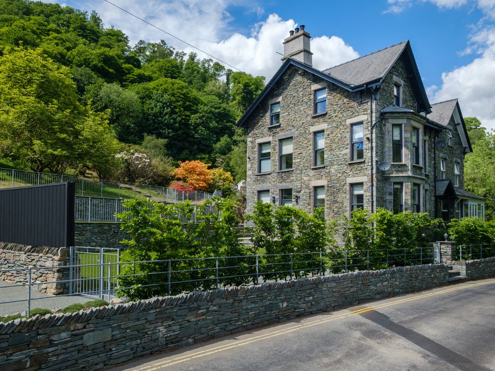 A stone building surrounded by greenery at Riverside in Ambleside