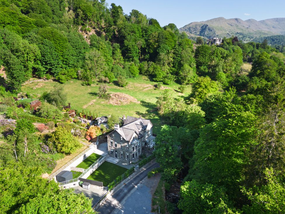 A house surrounded by garden and trees at Riverside in Ambleside