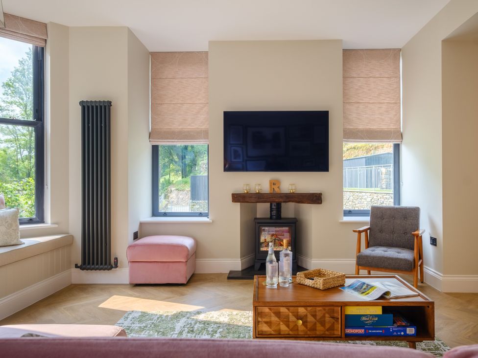 A living room with a television and coffee table at Riverside in Ambleside