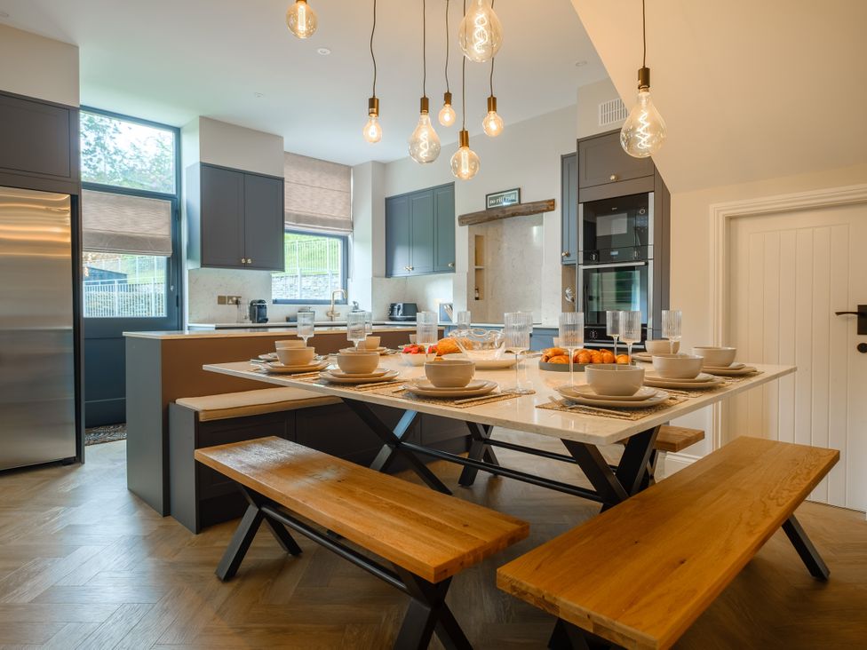 A kitchen with a dining table set for meals at Riverside in Ambleside