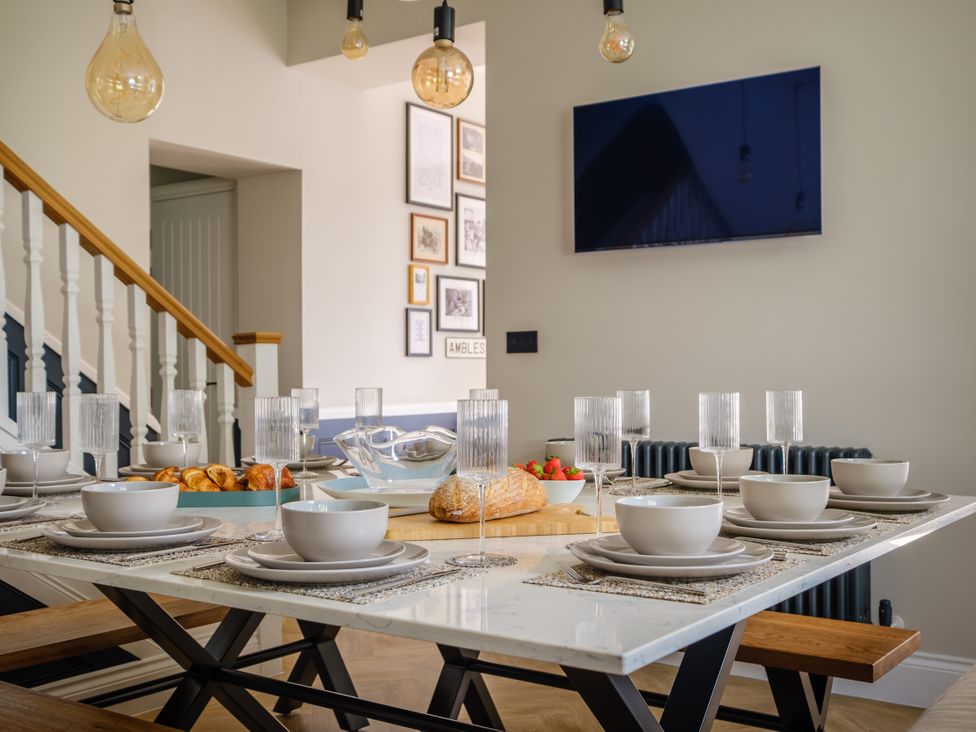 A dining room with a set table at Riverside in Ambleside
