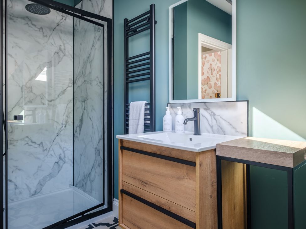 A bathroom with a shower and sink at Riverside in Ambleside