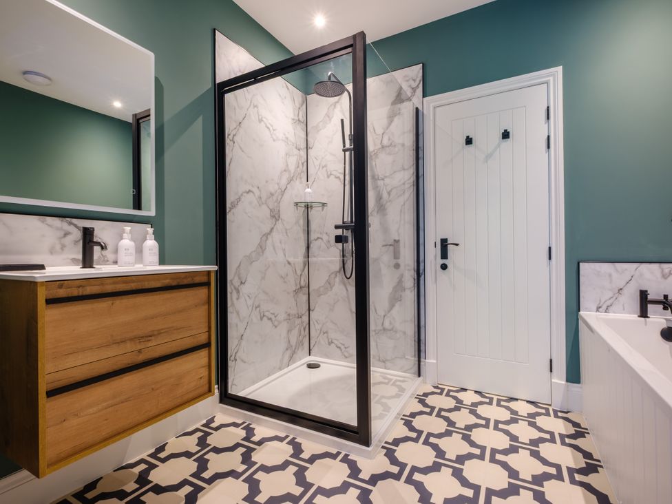 A bathroom with a shower and sink at Riverside in Ambleside