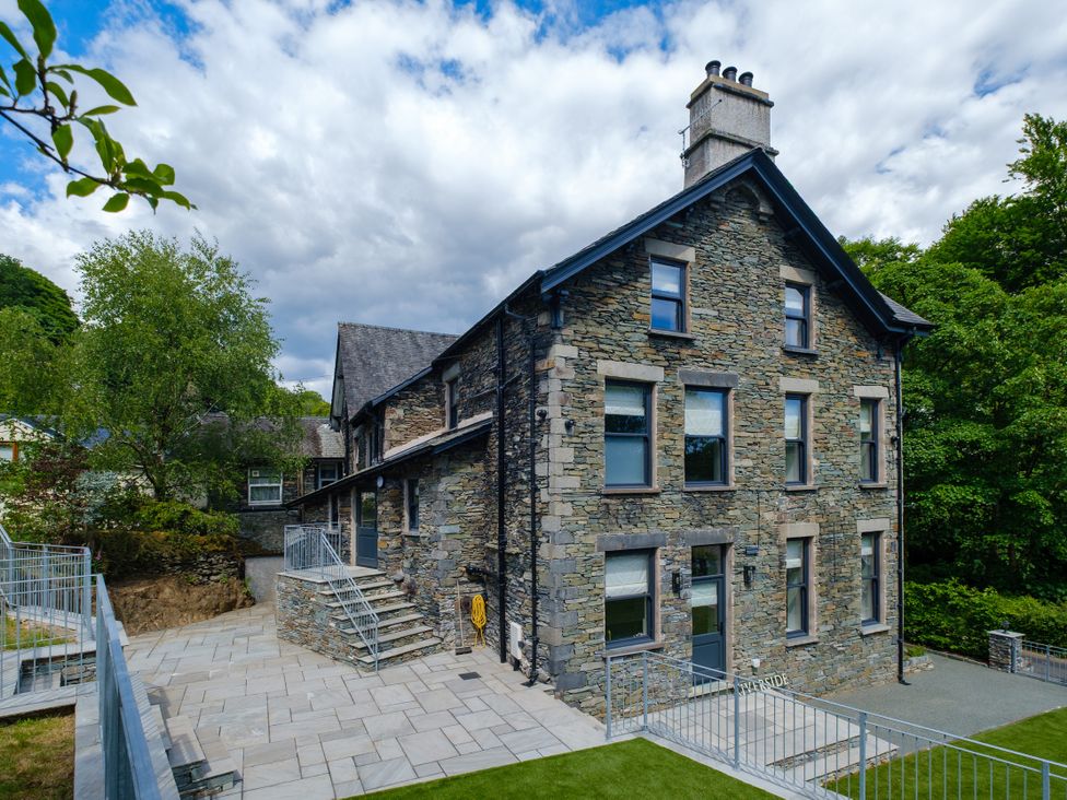 A building with stone walls and windows at Riverside in Ambleside