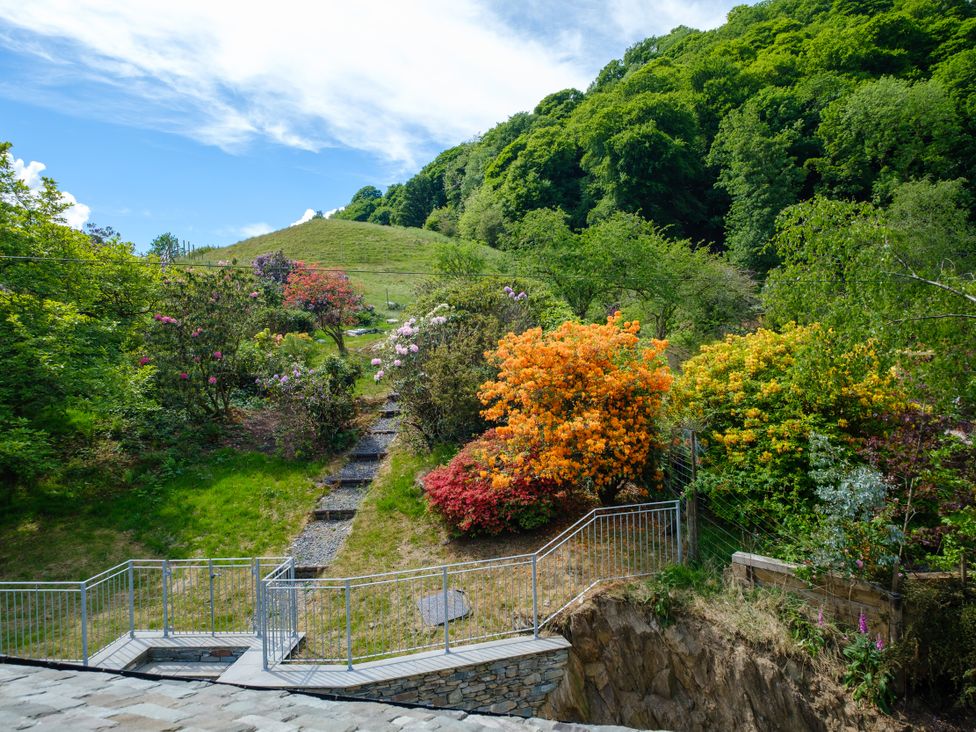 A garden with steps and colorful flowers at Riverside in Ambleside