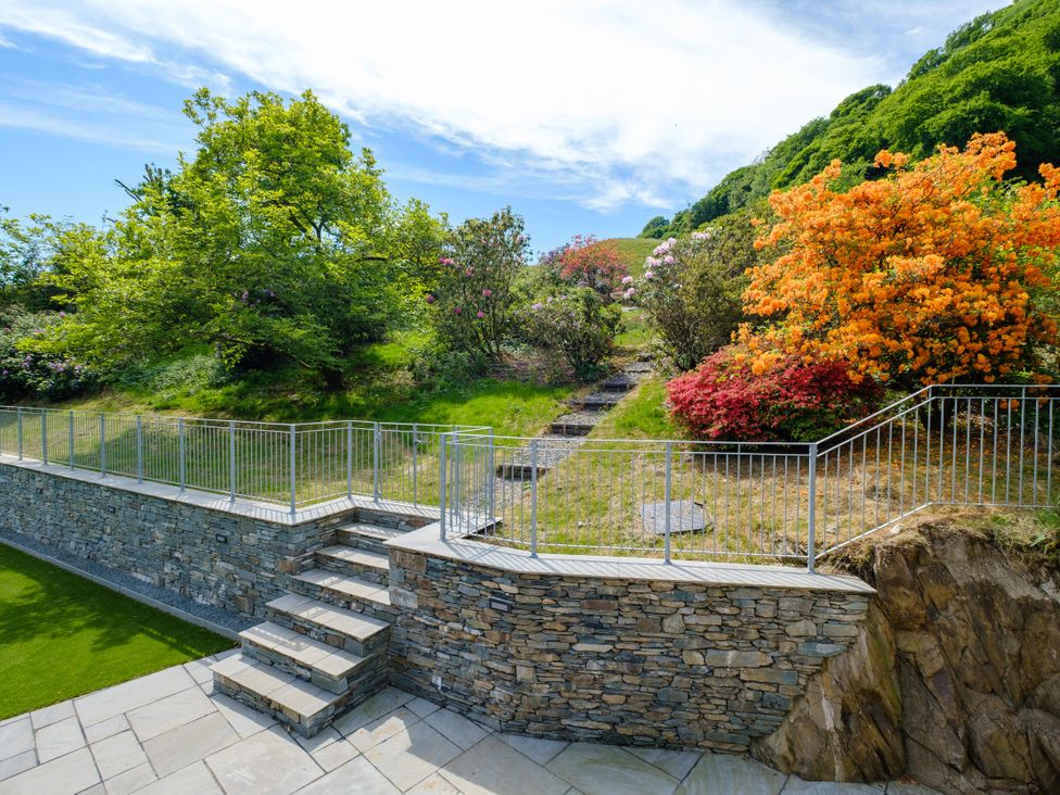 A garden with steps and colorful flowers at Riverside in Ambleside