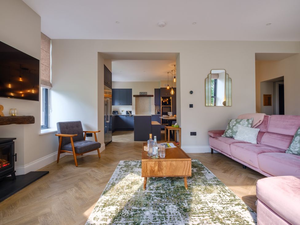 A living room with a coffee table and sofa at Riverside in Ambleside