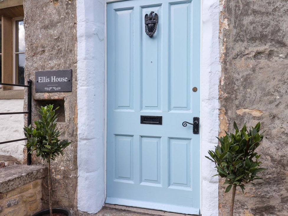 A front door with a sign at Ellis House Skipton