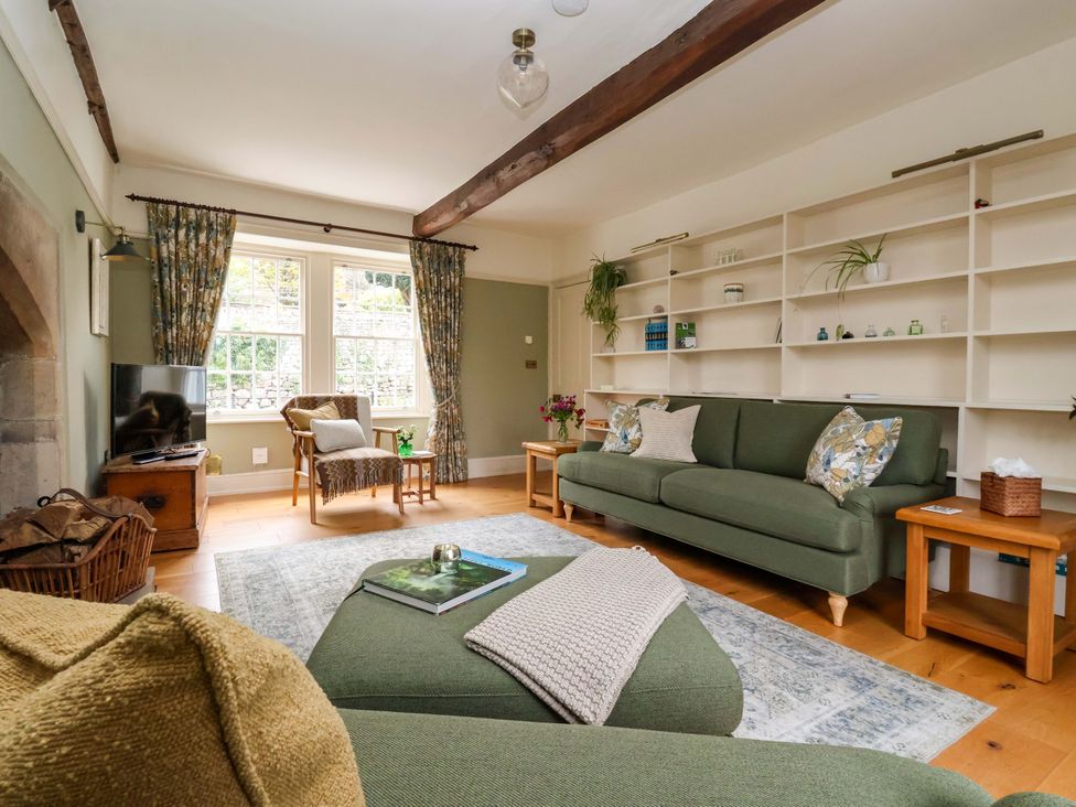 A living room with seating and television at Ellis House in Skipton