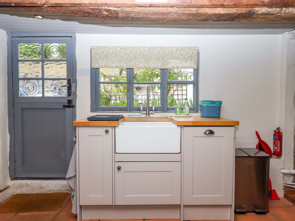 A kitchen with a sink and cabinet at 1 Myrtle Cottages Stokeinteignhead