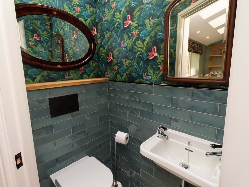 A bathroom with a sink and toilet at 9 Longhirst Village in Morpeth