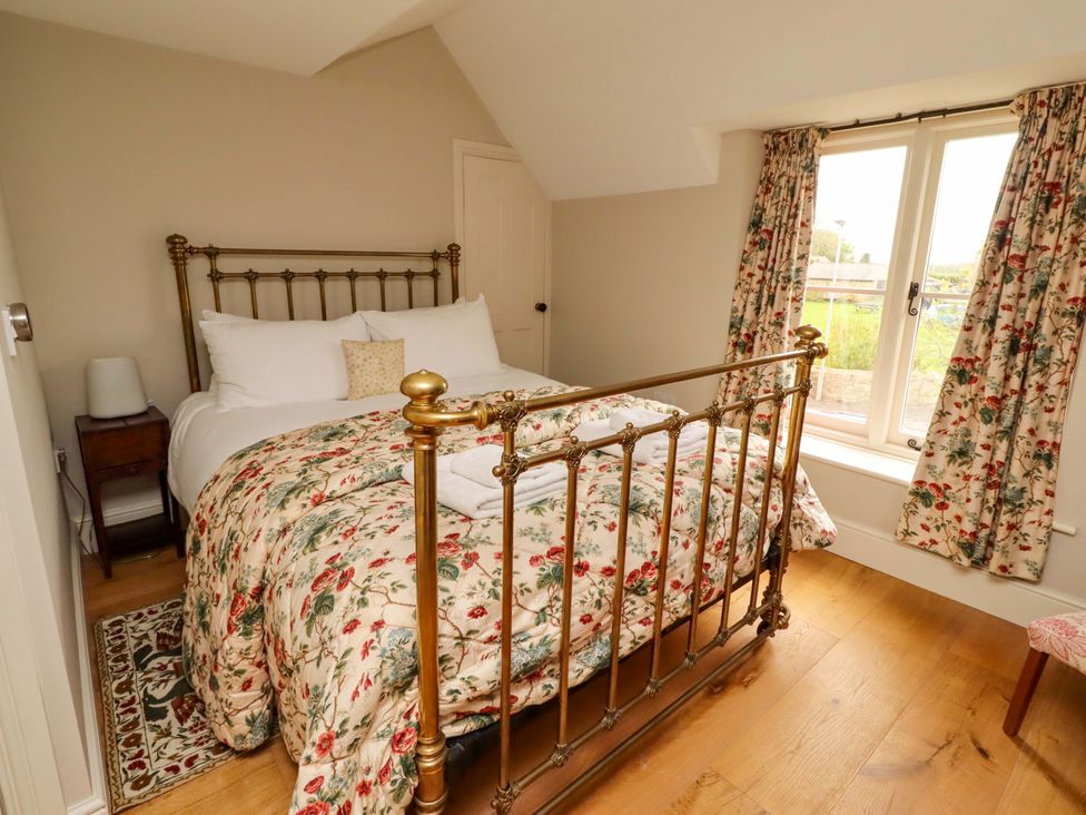 A bedroom with a bed and window at 9 Longhirst Village Morpeth