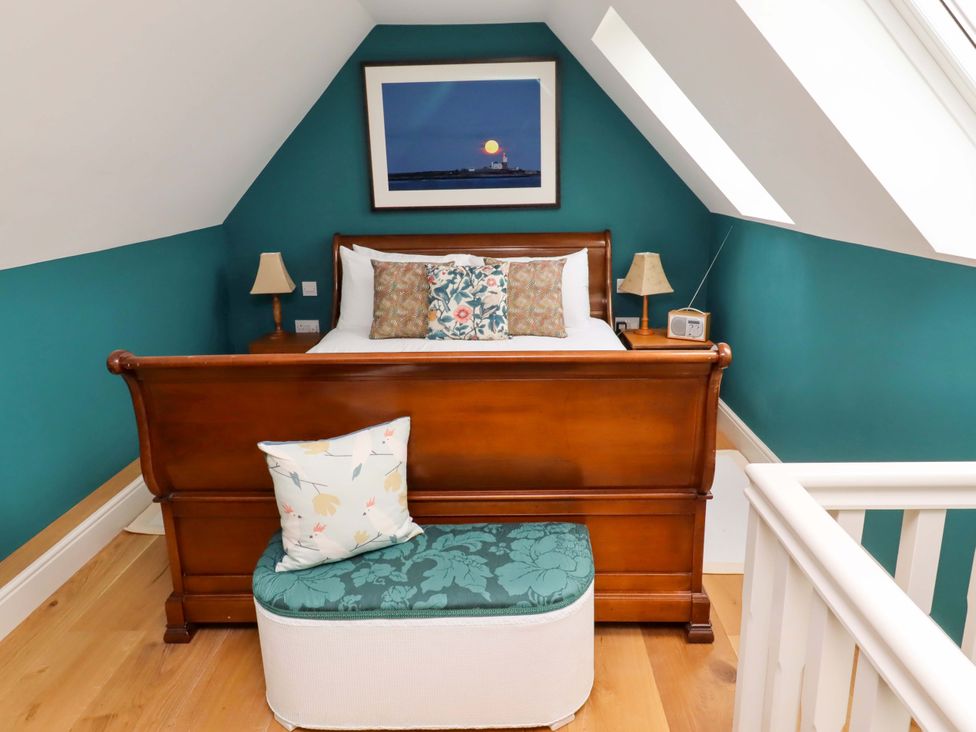 A bedroom with a bed and pillow at 9 Longhirst Village in Morpeth