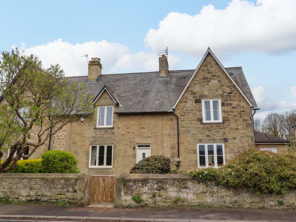 A house with stone walls and a garden at 9 Longhirst Village Morpeth