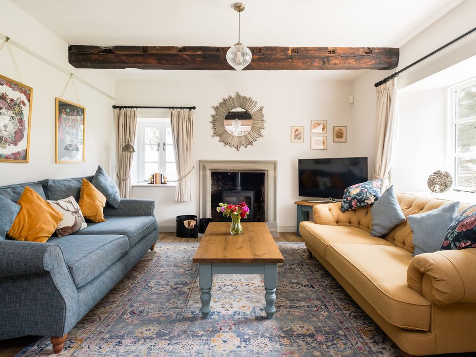 A living room with two sofas and a coffee table at Henhouse Farm in Bodenham