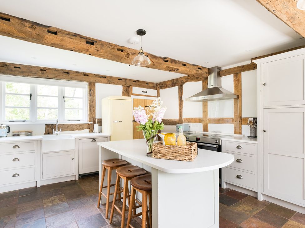 A kitchen with a refrigerator and stove at Henhouse Farm in Bodenham