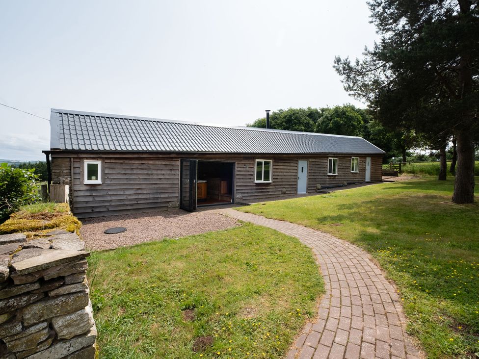 A house with a pathway and grass at Henhouse Farm Bodenham