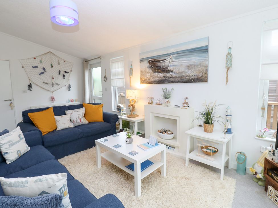 A living room with a sofa and coffee table at The Sanctuary Badgers Retreat Holiday Park near Catterick Garrison, North Yorkshire