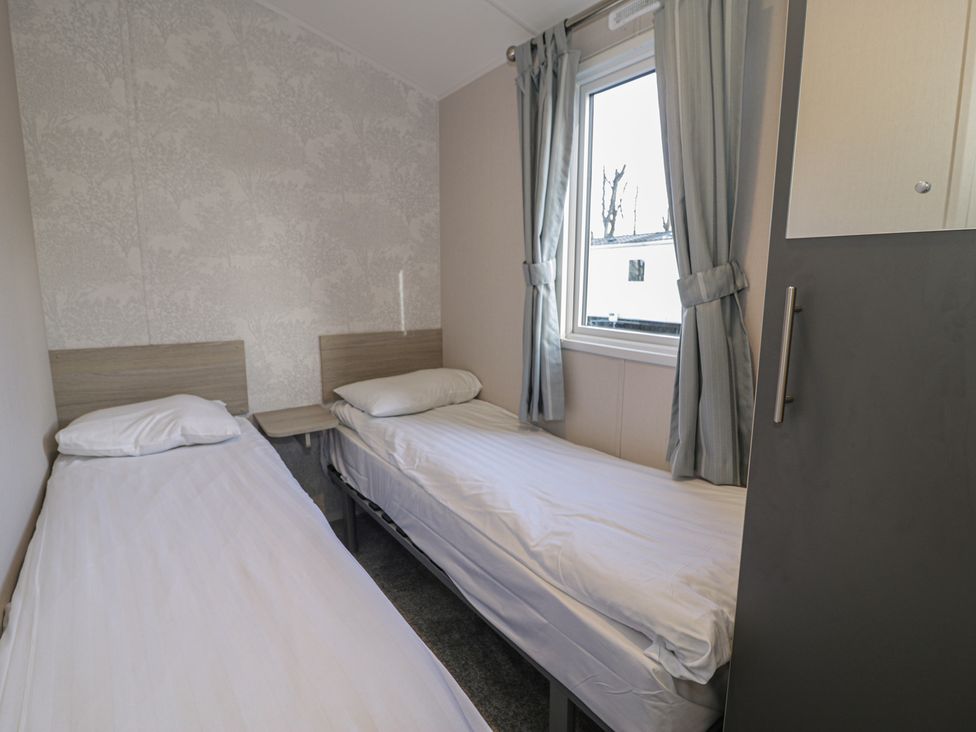 A bedroom with two single beds at Lido Gold 120 Prestatyn