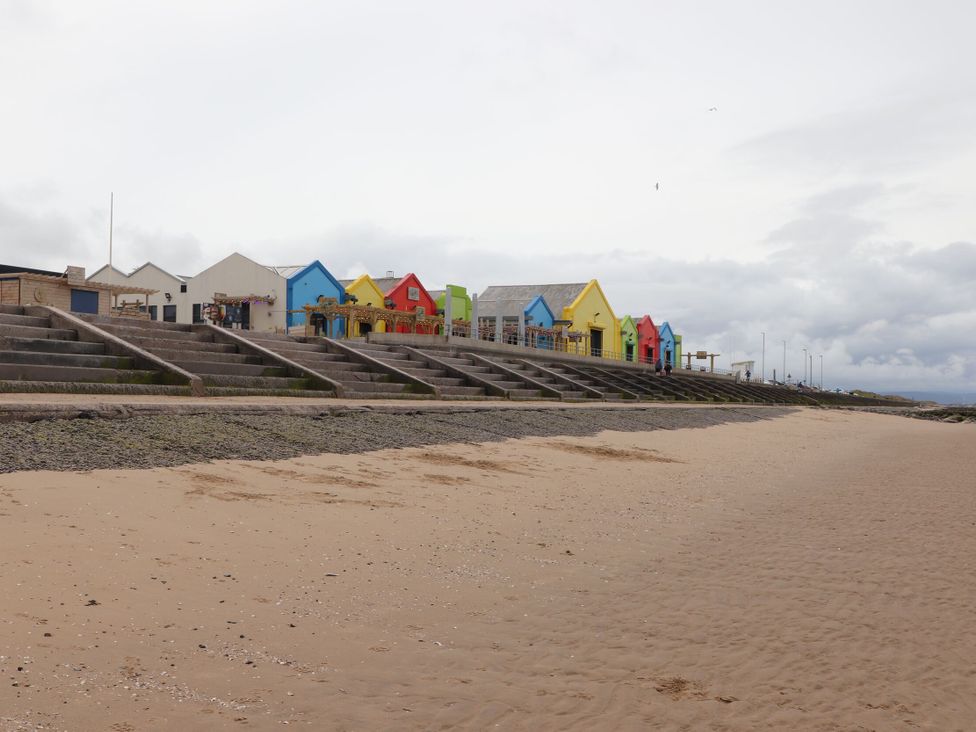 Beach huts along the shore at Lido Gold 120 in Prestatyn