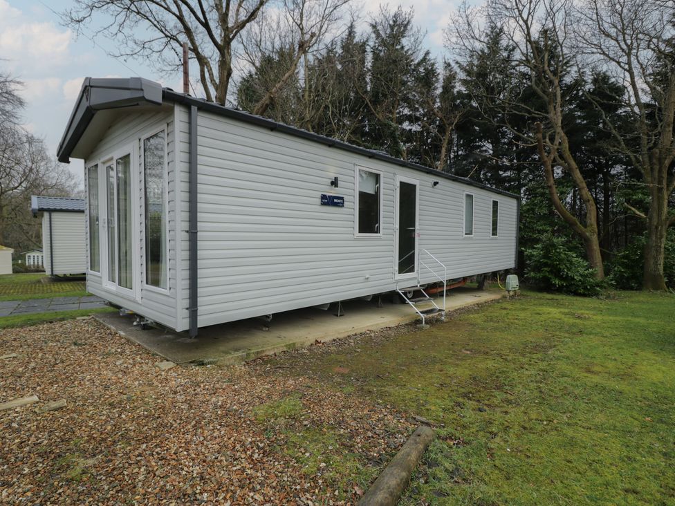 A cabin with windows and steps at Woodlands Gold (WO06) Ruthin
