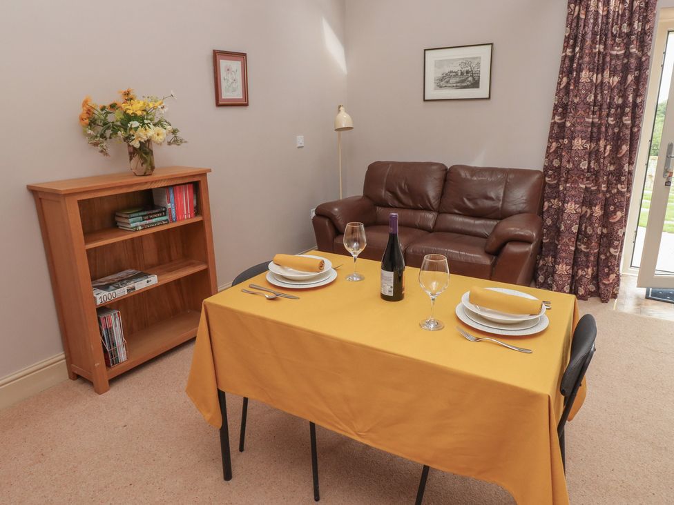 A dining room with a table set for two at Annex in Morpeth