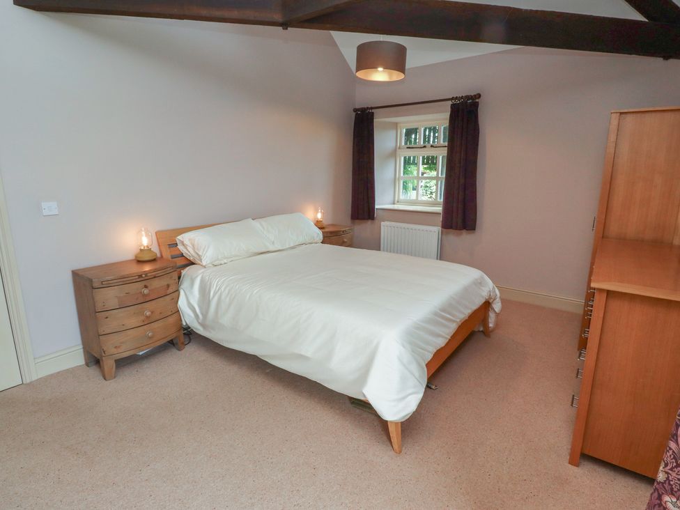 A bedroom with a bed and bedside tables at Annex in Morpeth