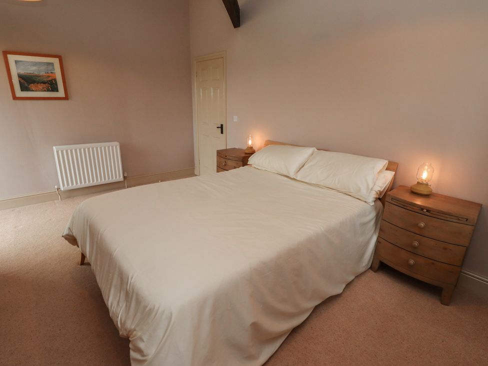 A bedroom with a bed and bedside tables at Annex in Morpeth