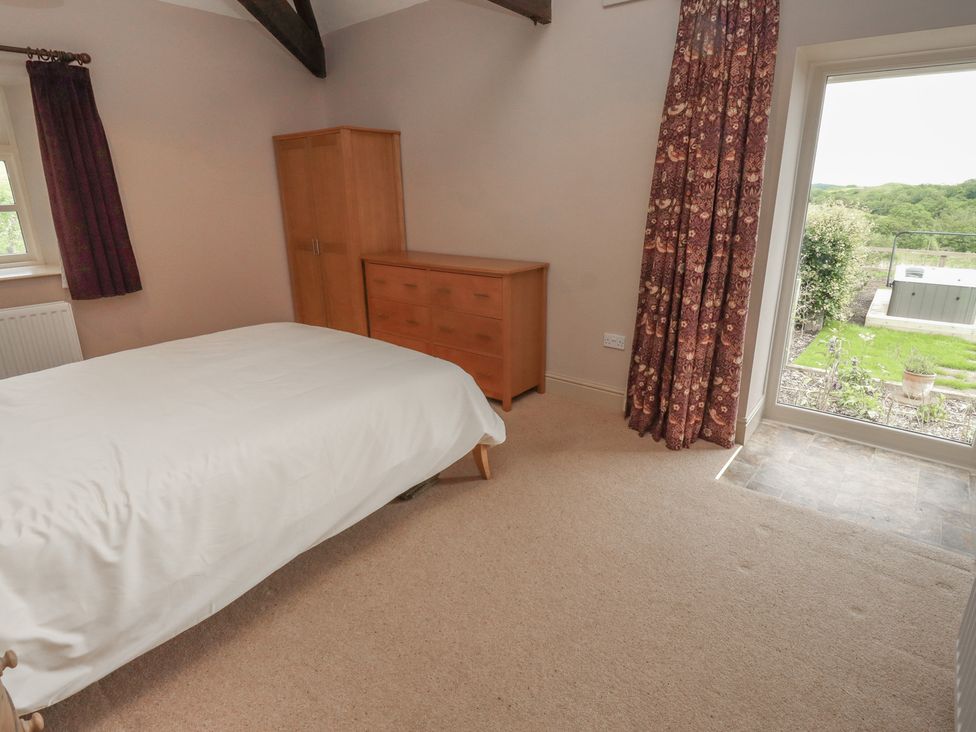A bedroom with a bed and chest of drawers at Annex in Morpeth