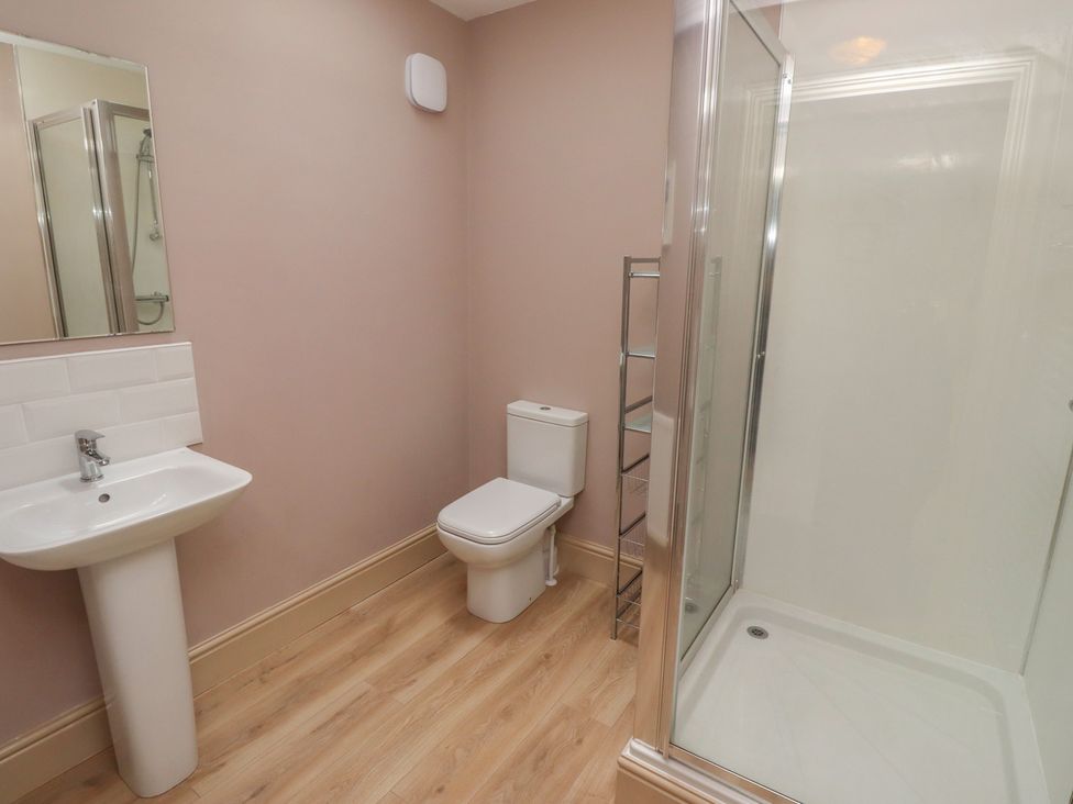 A bathroom with a sink, toilet, and shower at Annex in Morpeth