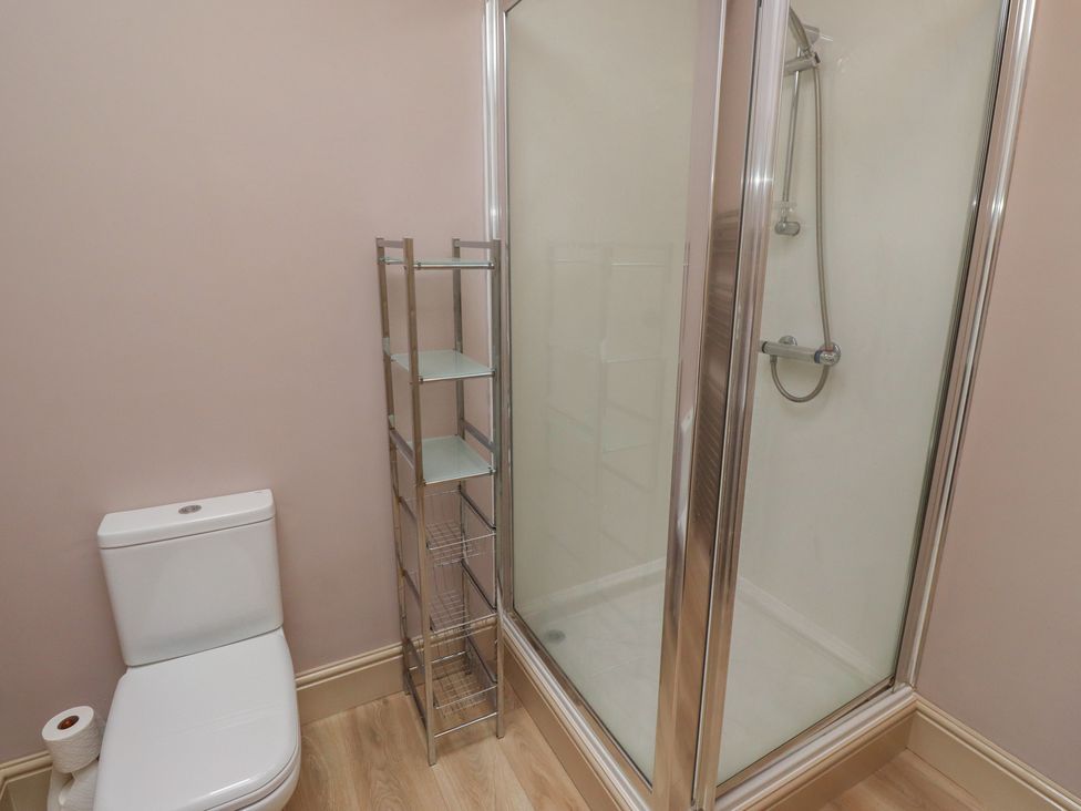A bathroom with a toilet and a shower at Annex in Morpeth