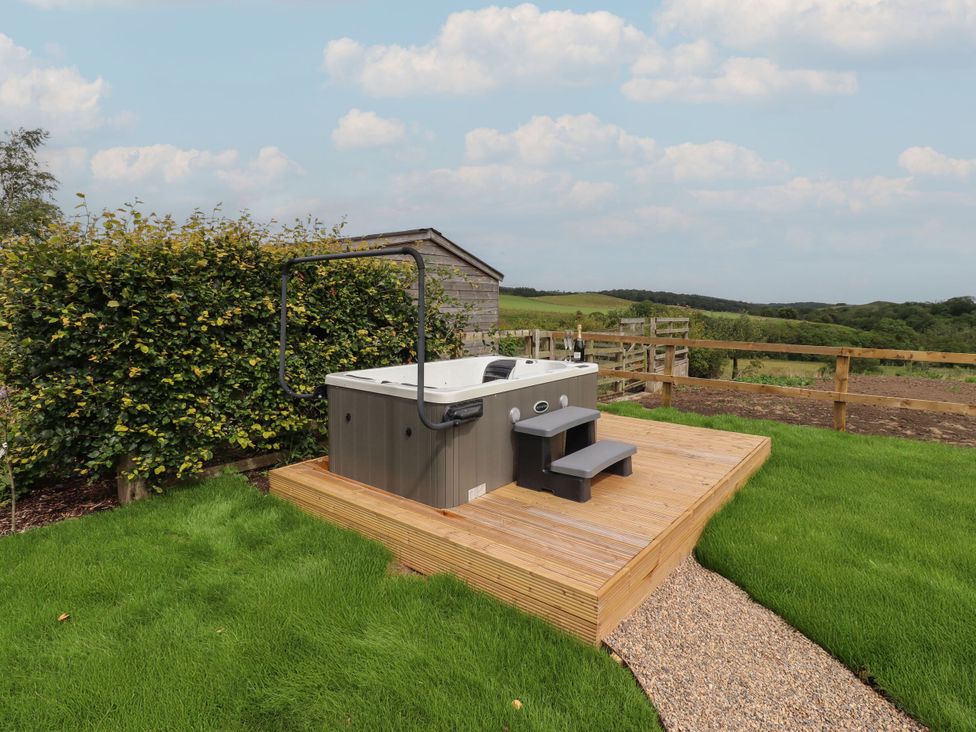 A hot tub on a deck area at Annex Coldrife near Rothbury