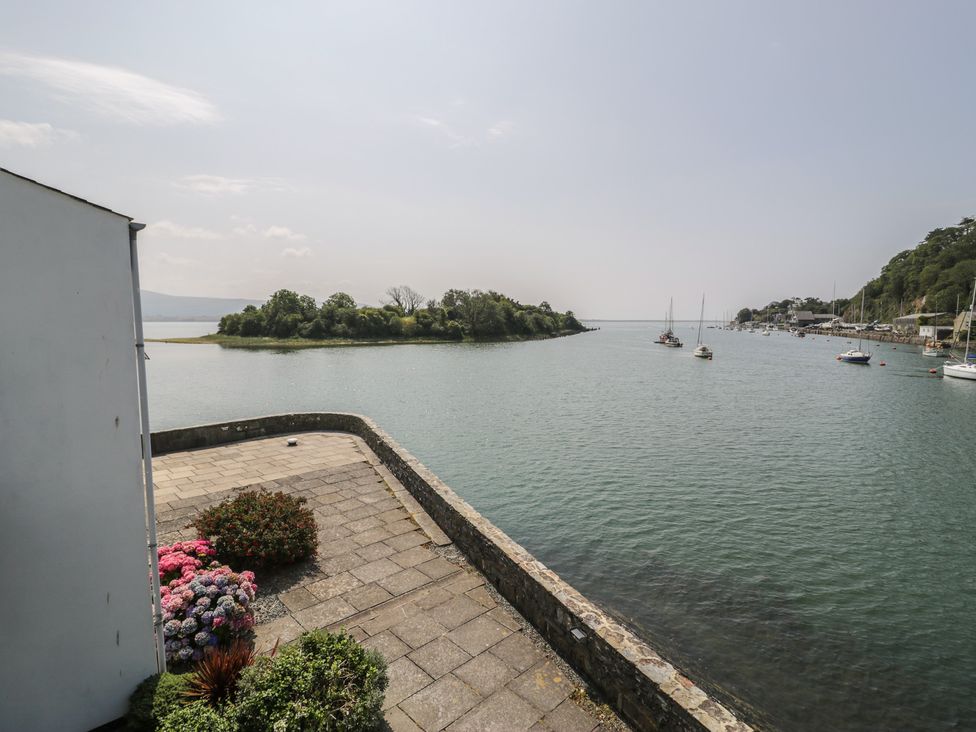 An outdoor view of water and boats at Seafarer's Haven in Porthmadog