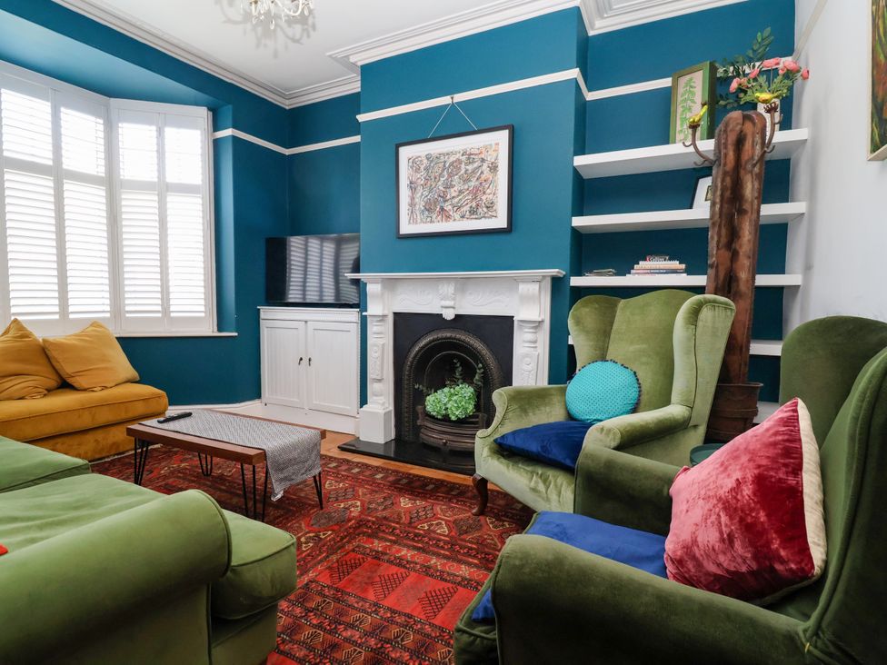 A living room with a fireplace and furniture at 45 Brook Lane Chester