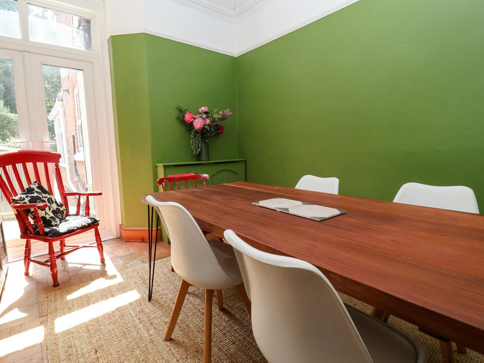 A dining room with a table and chairs at 45 Brook Lane Chester
