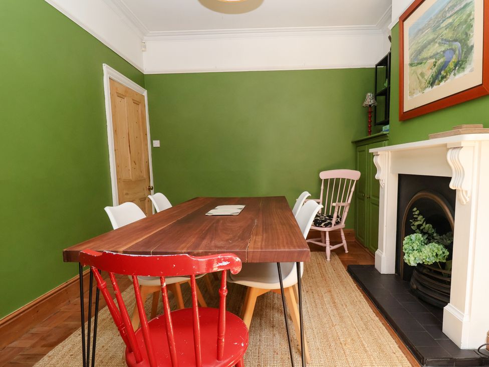 A dining room with a table and chairs at 45 Brook Lane in Chester