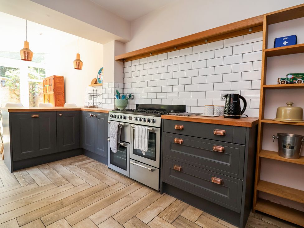 A kitchen with cabinets, oven, and shelves at 45 Brook Lane in Chester