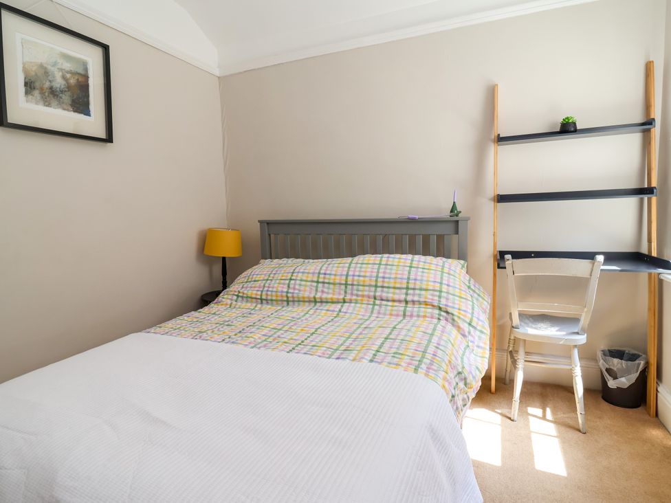 A bedroom with a bed and chair at 45 Brook Lane Chester